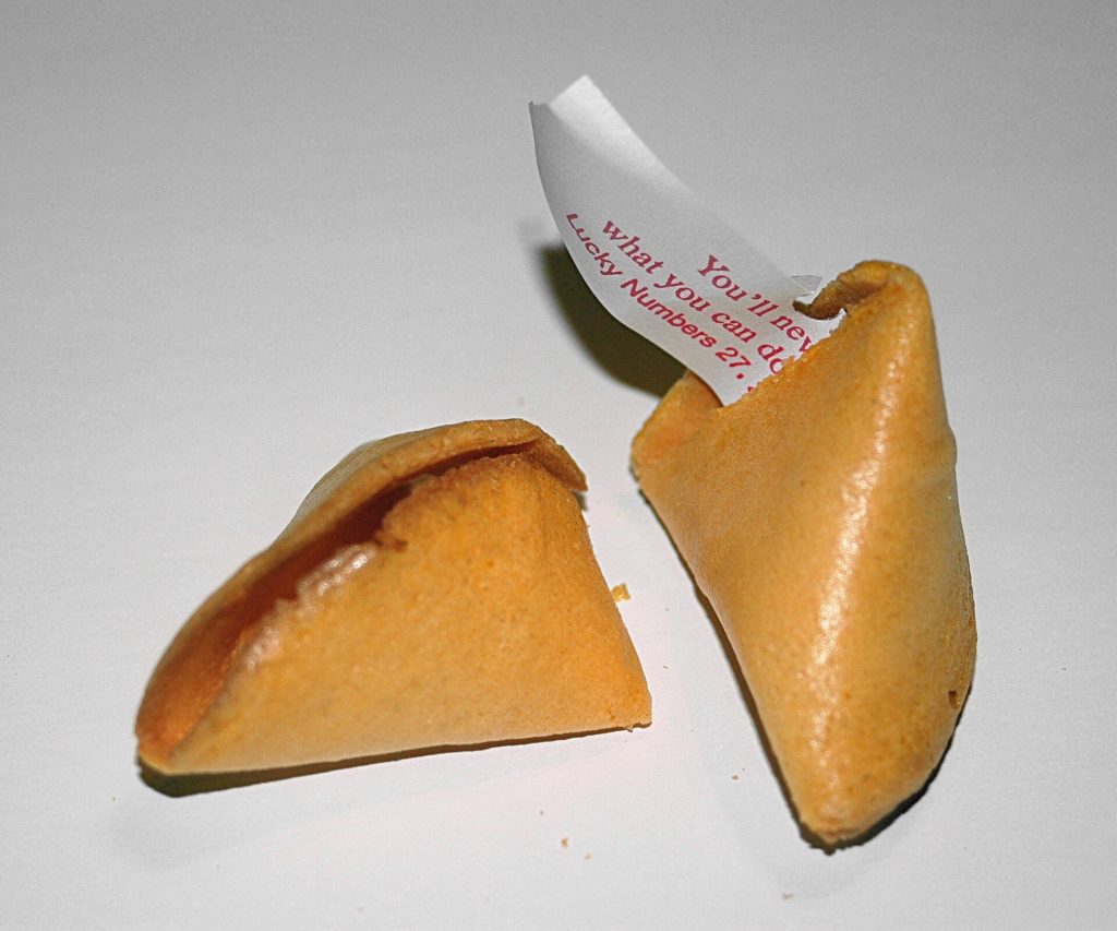 A small pile of golden fortune cookies