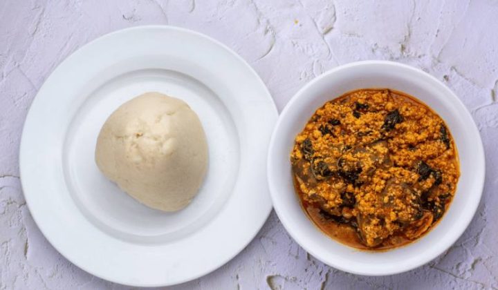 Fufu served in a bowl alongside West African soup