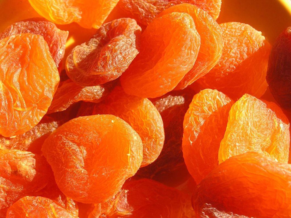 A bowl of orange dried apricots