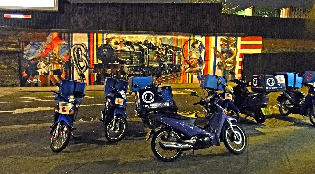 Delivery scooter parked on a city street