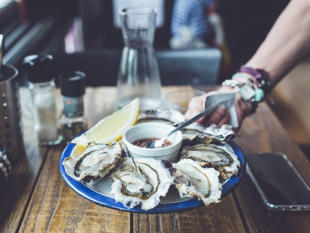 Fresh oysters on the half shell served on crushed ice